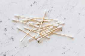 cotton buds on white surface